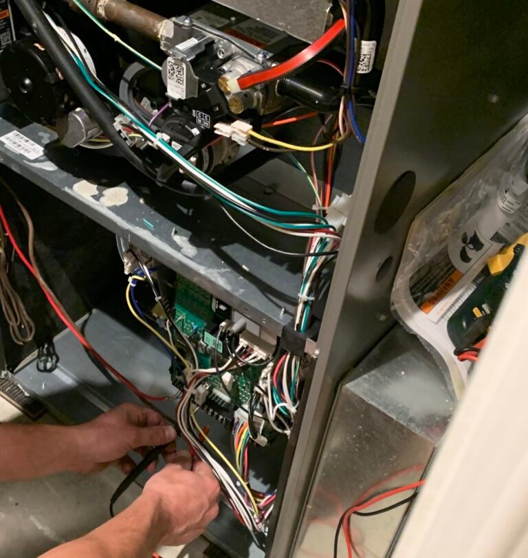 furnace repair technician servicing gas furnace in Barrie Ontario